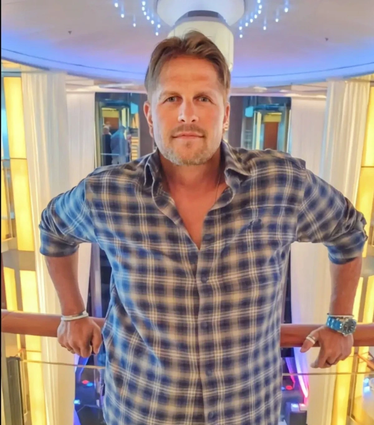 Brian Myk portrait in blue plaid shirt